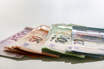 Wall Mural - Closeup shot of different Euro banknotes with white background