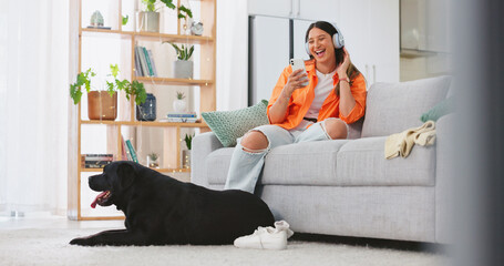 Poster - Phone, headphones and laughing woman with dog on sofa in home living room. Comic, relax and happy female streaming music, radio or podcast with smartphone while playing with animal, pet or bonding.