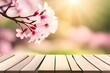 Kirschblüten - leehre Holzplatte im Vordergrund für Produktanzeige, frühlingsnatur unscharfer hintergrund