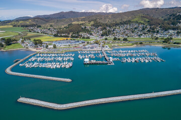 Wall Mural - El Granada, Califonia. Pillar Point Harbor in Princeton. Boats and Yachts in Background. Indian Ocean. Clear Blue sky. USA