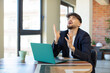 © kues1 - young handsome man screaming with hands up in the air. freelance concept with laptop