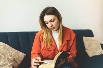 Wall Mural - A woman is holding a Bible and praying. Studying the Holy Scriptures. Spiritual growth. Faith and spirituality. Bible study and prayer. Oration.