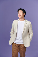 Wall Mural - portrait of asian young smiling man standing on white background