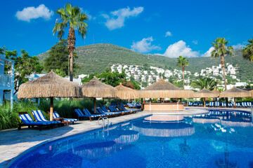 Poster - swimming pool with coconut tree and white umbrella