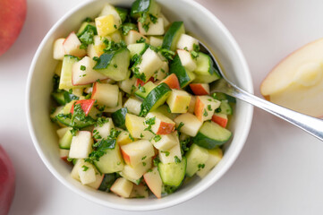 Wall Mural - Cucumber Apple salad marinated with honey, lemon juice, oilive oil and parsley