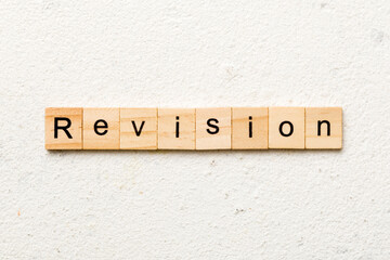 revision word written on wood block. revision text on table, concept