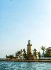 Wall Mural - A lighthouse and the waterfront park in Cartagena city (Colombia).