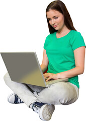 Canvas Print - Student sitting on floor in library using laptop 