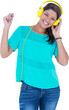 Smiling woman enjoying music through headphones
