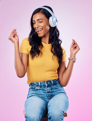 Poster - Music, headphones and Indian woman dance on pink background listening to track, audio and radio. Relax, happy and isolated girl singing streaming song for dancing, chilling and happiness in studio