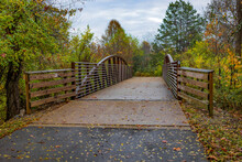 Footbridge Through Autumn Coloured Forest; Antioch, Tennessee, United States Of America