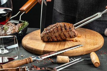 Wall Mural - Grilled meat steak and adding seasoning, Fresh raw Prime Black Angus beef steak on a fork