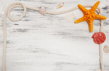 Abstract Gray Wooden Nautical Background With Starfish, Shells And Rope