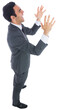 Excited businessman with arms raised