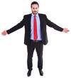 Unsmiling businessman standing with arms outstretched