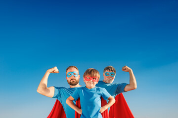 Canvas Print - Grandfather, father and son having fun outdoor. Fathers day