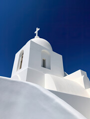 White church on the mountainside of a greek island - AI Generated