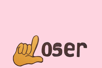 Word LOSER with drawn hand on pink background