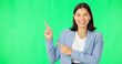 © Nina L/peopleimages.com - Business, happy woman and face on green screen pointing to mockup background, studio and smile. Portrait of female worker advertising promotion, product placement and announcement of deal coming soon