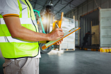 Wall Mural - Worker Holds a Clipboard Checking the Loading Cargo Shipment at Distribution Warehouse. Forklift Loading Delivery to Customers. Package Boxes Supplies Warehouse. Freight Truck Logistics Transport	
