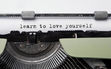 Wall Mural - text learn to love yourself typed on retro typewriter