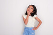 © KrishnaTedjo - Asian little girl looking up with hand on chin thinking about something