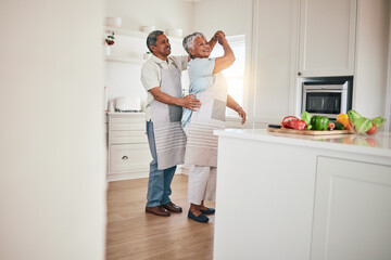 Wall Mural - Happiness, cooking and senior couple dancing in the kitchen together feeling happy, excited and bonding in a home. Care, love and romantic old people or lovers dance enjoying retirement in a house