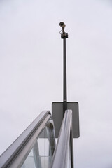 The monitoring of security cameras at the top of an outdoor escalator to monitor the safety of citizens