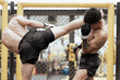 © Nassorn - Professional boxers with glove fighting in competition match. Young muscular athlete challenge strength punch in MMA arena. Two male fighter martial in ring. Boxing knockout champion battle concept