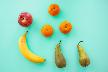 Poster - Delicious ripe fruits isolated on a blue background