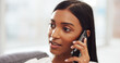 © S Fanti/peopleimages.com - Phone, communication and call with a woman talking on her mobile while sitting on a sofa in the living room of her house. Speaking, conversation and discussion with an attractive young female at home