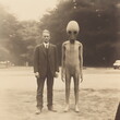 © Ricky - vintage sepia photograph of alien standing next to man, made with generative ai