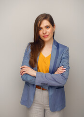 Poster - Portrait of serious woman in blue suit and yellow shirt.