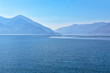 View to beautiful Lago Maggiore surrounded by blue mountains from Ascona, Switzerland