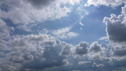 Wall Mural - sunny blue sky with clouds 4k video time lapse. white fluffy clouds flying fast overhead in clear bl