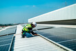 © FotoArtist - Team electrician installing solar panels working on alternative energy sources clean.