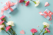 canvas print picture - Mother's Day memories concept. Top view flat lay photo of gift boxes with pink ribbons, carnation flowers, and pink paper hearts on pastel blue background with empty space for text or advert