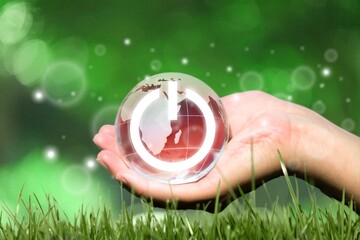 Wall Mural - globe of earth with image of power button in hand
