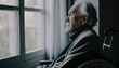 Senior man disabled sitting alone in wheelchair looking through window at hospital, lonely elder thoughtful sad old man look outside in bedroom at retirement home, feel depressed lonely. Generative AI