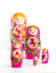 Wall Mural - Russian Matryoshka Dolls in different sizes. Traditional Matryoshka set in a row. Set of wooden toys on white background.