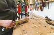 Carpenter during work. Woodworking expert glueing two wood pieces together with bar clamps. Indoor closeup shot. High quality photo