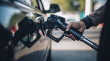 A customer filling up their car at a gas station. The background be blurred to draw attention to the fuel pump and the fueling process. Generative AI