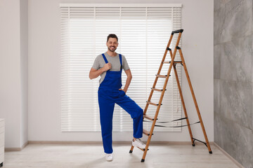 Poster - Worker in uniform and stepladder near horizontal window blinds indoors