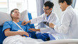 © Phushutter - The medical team visits the car accident patients who are lying on the nursing bed and arm cast with wrapping nurse bandages splint to the arm.