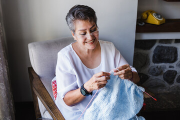 latin senior woman retired knitting at home in Mexico Latin America, hispanic people