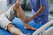 © Sirikarn Rinruesee - Physiotherapist working with patient in clinic, closeup