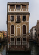 Old iconic building in Venice, Italy in middle of two canals