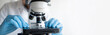 © kite_rin - Medical laboratory, scientist hands using microscope for examining samples and liquid, Scientific and healthcare research banner background