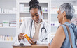 © C. Davids/peopleimages.com - Black woman, doctor and prescription medication for patient or over the counter pills at pharmacy. African medical pharmacist consulting senior client for dosage, symptoms or side effects at clinic