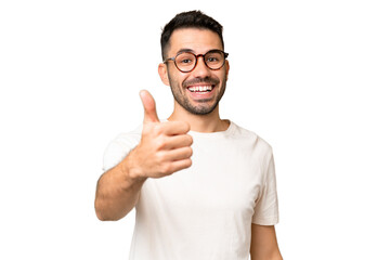 Wall Mural - Young handsome caucasian man over isolated chroma key background with thumbs up because something good has happened